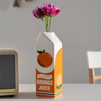 Kleine moderne keramische hydroponische tafelvase in oranje Ideaal voor thuis en restaurant