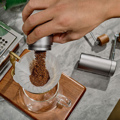 10 dollar Mini roestvrij staal handmatige koffiemolen Mal je koffie tot in de perfectie