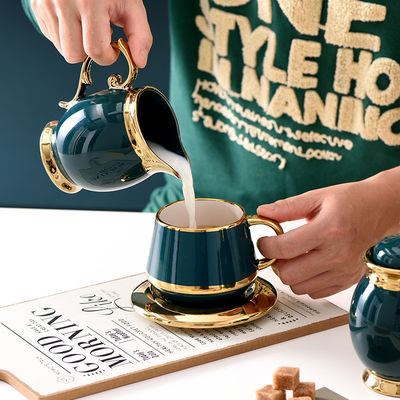 Fancy koffiekopjes met gouden rand Keramische thee set101 met roestvrij staal